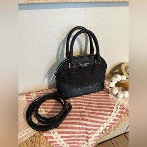 Kate Spade New York Sylvia Mini Dome Glitter Satchel in black.